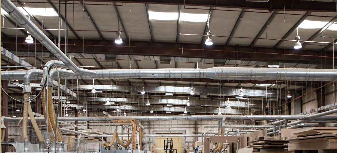 Factory hall ceiling with dust extraction ducts