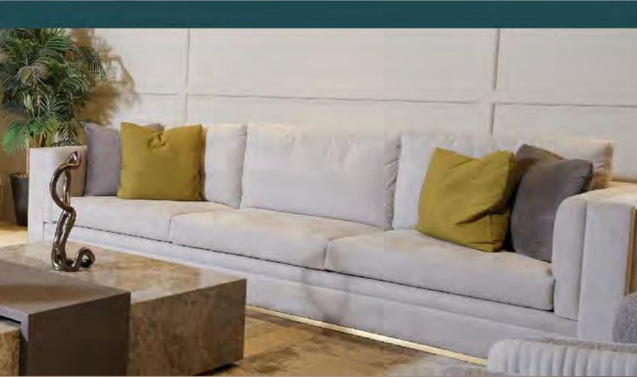 Living room with white sofa and sculptural decor
